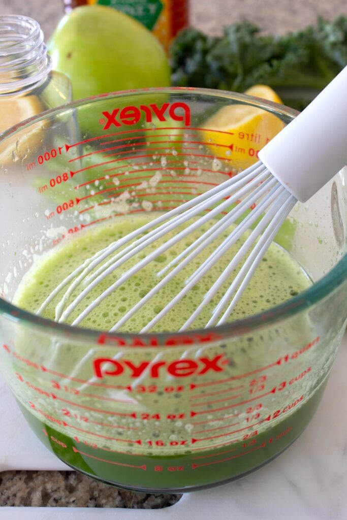 pyrex glass dish with a silicon whisk in it