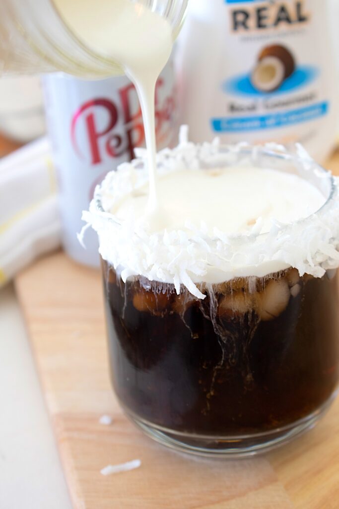 dirty Dr Pepper in a glass with cloud foam