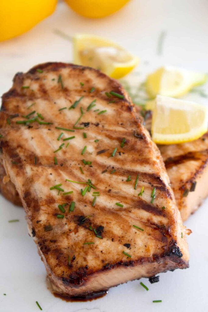grilled swordfish on a platter