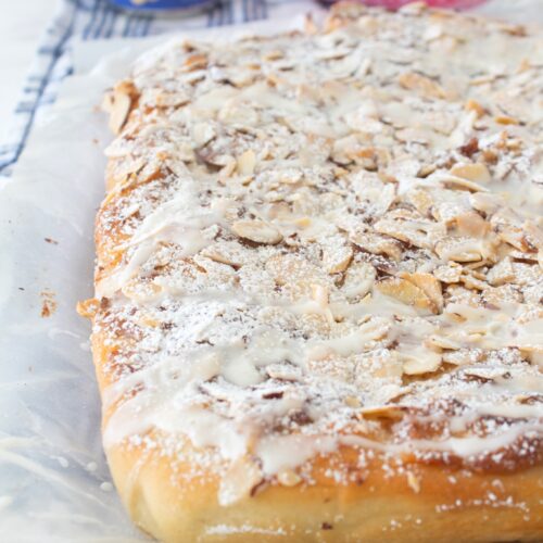 almond focaccia bread fresh out of the oven on parchment paper